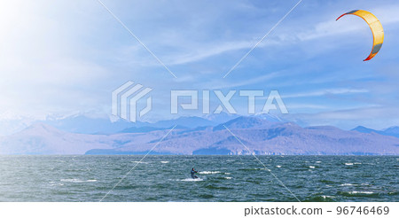 Kitesurfing on the waves in the Pacific Ocean off the coast of the Kamchatka Peninsula Kitesurfing on the waves in the Pacific Ocean off the coast of the Kamchatka Peninsula 96746469