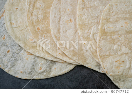 Corn tortillas on black background. Unleavened bread. Mexican tortillas 96747712