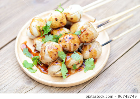 Meatballs on plate with with spicy sauce, Grilled meatball and pork ball, Meat ball on skewers and fresh coriander vegetables cabbage, Thai food Asian food Meat balls - pork balls 96748749
