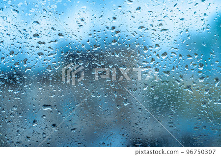 Rainy background, rain drops on the window, autumn season backdrop, abstract textured wallpaper. Raindrops on transparent window Rainy background, rain drops on the window, autumn season backdrop, abstract textured wallpaper. Raindrops on transparent window 96750307