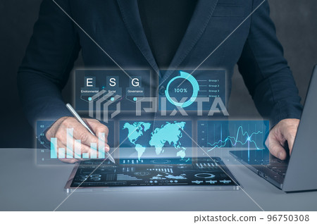 Digital Transformation. Businessman working at modern office. modern virtual interface. Man using modern tablet for business management according to esg principles Digital Transformation. Businessman working at modern office. modern virtual interface. Man using modern tablet for business management according to esg principles 96750308