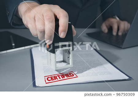 certified red stamp on document. business approve and certificate concept, confirmation of business marketing document permit and certified stamping certified red stamp on document. business approve and certificate concept, confirmation of business marketing document permit and certified stamping 96750309