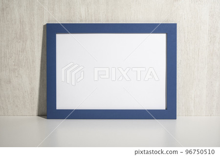 Horizontal frame mockup on white bench, table. Mockup diploma. Certificate, diploma, picture, gratitude blue blank frame mockup. White wooden wall background 96750510