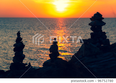 Zen concept. The object of the stones on the rock at sunset. Zen stones.. 96752780