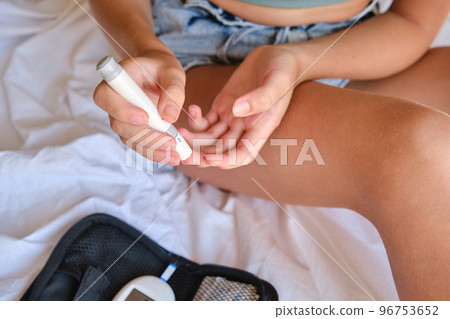 Diabetes and glycemia, the child examines the level of sugar. A blood test for glucose levels. 96753652