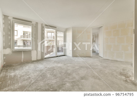 Interior of empty white room with large balcony windows with curtains and wooden parquet floor 96754795