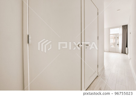 Interior of empty white kitchen with windows and wooden parquet floor 96755023