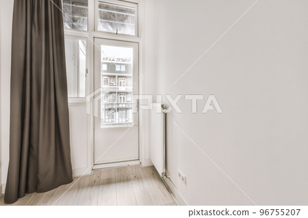 Plastic window and radiator on white wall in empty light room at home Plastic window and radiator on white wall in empty light room at home 96755207