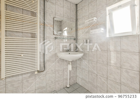 Interior of contemporary bathroom with shower and sink in minimal style in flat 96755233