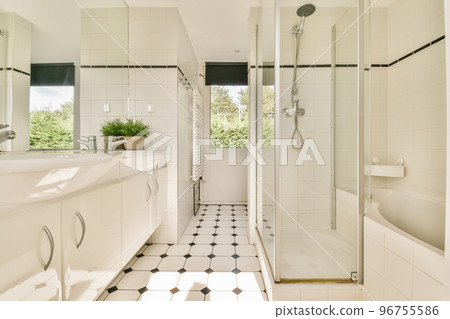 Glass partition between shower tap and wall hung toilet in modern restroom at home Glass partition between shower tap and wall hung toilet in modern restroom at home 96755586