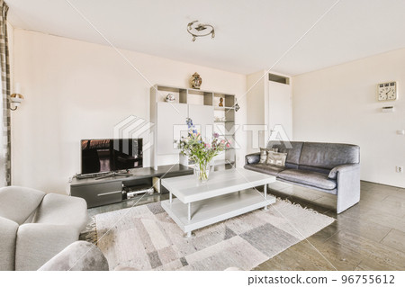 Counters with stove and oven located in modern kitchen near dining room at home 96755612