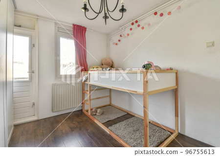 Interior of modern kid bedroom with bed and shelves with various toys at home 96755613