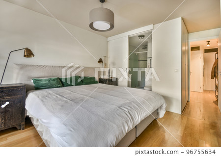 Bed and bedside table with desktop in small bedroom Bed and bedside table with desktop in small bedroom 96755634