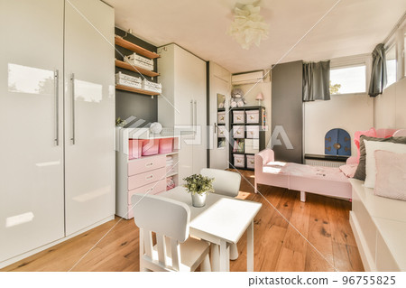 Interior of modern kid bedroom with bed and shelves with various toys at home 96755825