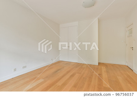 Interior of empty white room with windows with parquet and radiator Interior of empty white room with windows with parquet and radiator 96756037