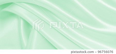Smooth elegant green silk or satin luxury cloth texture as abstract background. Luxurious background design 96756076