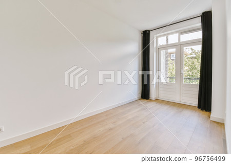 Plastic window and radiator on white wall in empty light room at home Plastic window and radiator on white wall in empty light room at home 96756499
