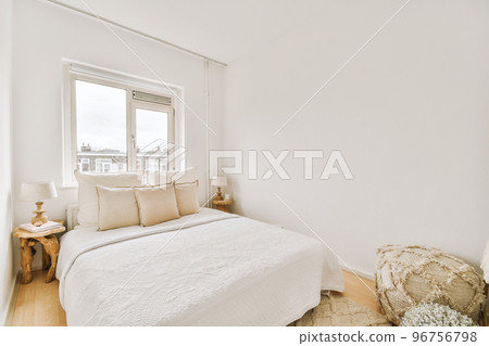Home interior design of bedroom with bed and wooden wardrobe placed in corner near window in modern apartment Home interior design of bedroom with bed and wooden wardrobe placed in corner near window in modern apartment 96756798