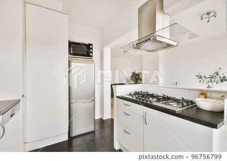Interior of a beautiful kitchen of an elite house Interior of a beautiful kitchen of an elite house 96756799