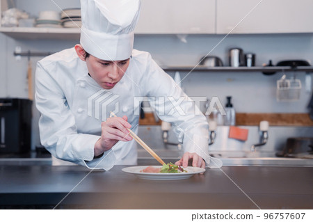 Professional chef serving ingredients 96757607