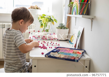 Confident cute baby boy playing and sculpt ball and toothpick design from plasticine fine motor skills early development Confident cute baby boy playing and sculpt ball and toothpick design from plasticine fine motor skills early development 96757771