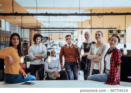 Multiethnic group of employees working in a marketing company. A group of colleagues is working on a project in modern offices 96759418