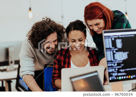 Multiethnic group of employees working in a marketing company. A group of colleagues is working on a project in modern offices 96760034