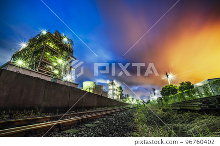 A night view of a factory in front of a cargo yard in Chidori-cho, the sky dyed red by the flare stack phenomenon [Kawasaki City, Kanagawa Prefecture] 96760402