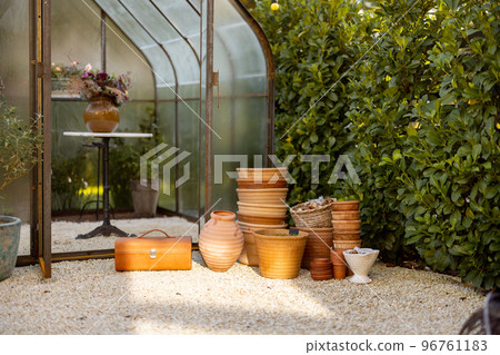 Clay pots in garden Clay pots in garden 96761183