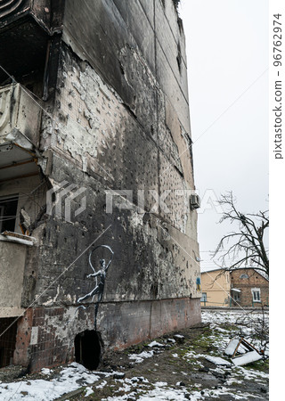 Irpin, Ukraine - Banksy graffiti on the wall of a destroyed house Irpin, Ukraine - Banksy graffiti on the wall of a destroyed house 96762974