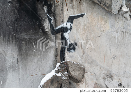 Graffiti by Banksy Gymnast Girl on the wall of a war-torn house in Borodyanka, Ukraine 96763005