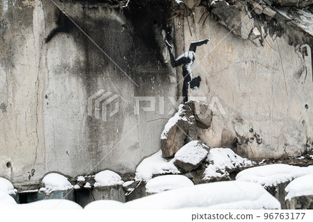 Wall of a destroyed building with Banksy graffiti in Borodyanka, Ukraine Wall of a destroyed building with Banksy graffiti in Borodyanka, Ukraine 96763177