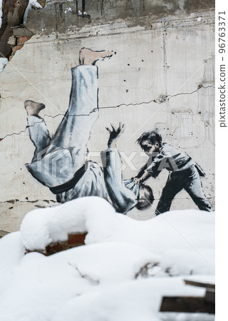 Banksy graffiti on a wall in Borodyanka, Ukraine 96763371