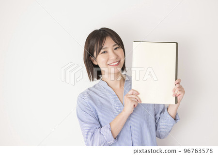 Woman with white notebook 96763578