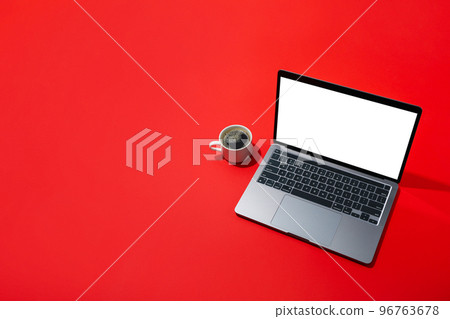 Coffee and laptop on red background, space for text Coffee and laptop on red background, space for text 96763678