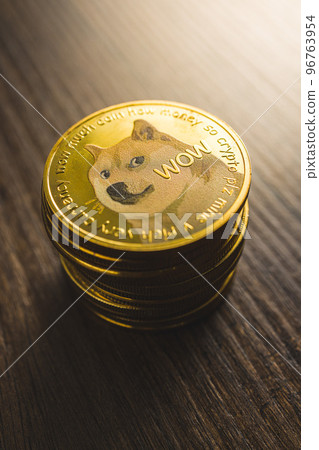Cryptocurrency. Dogecoin virtual money. Golden coin on wooden table. Cryptocurrency. Dogecoin virtual money. Golden coin on wooden table. 96763954