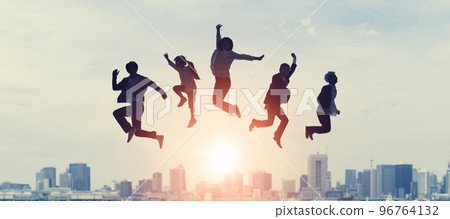 people jumping in front of city 96764132