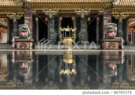 Metal golden dragons sculpture decorate on golden incense burner and Two stone Lion statue in front of Shrine at Wat thamma katanyu. Metal golden dragons sculpture decorate on golden incense burner and Two stone Lion statue in front of Shrine at Wat thamma katanyu. 96765578