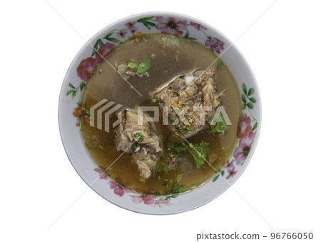 Pork rib soup or Pork bone soup seasoning with soy sauce and pepper sprinkled with coriander in bowl isolated on white background with clipping path. Pork rib soup or Pork bone soup seasoning with soy sauce and pepper sprinkled with coriander in bowl isolated on white background with clipping path. 96766050