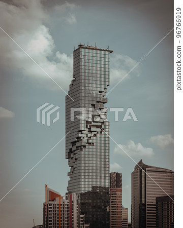 Architectural exterior view of King Power Mahanakhon Building is a mixed-use skyscraper with other modern high-rise buildings. Architectural exterior view of King Power Mahanakhon Building is a mixed-use skyscraper with other modern high-rise buildings. 96766919