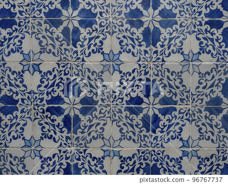 Blue ceramic tiles from facade of old houses in Lisbon Portugal. Portuguese traditional Azulejos decorative artistic design background, creative texture surface 96767737