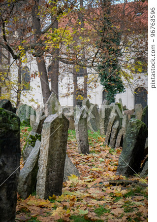 Old Jewish Cemetery Prague in Czech Republic in late autumn. Defocused 96768596