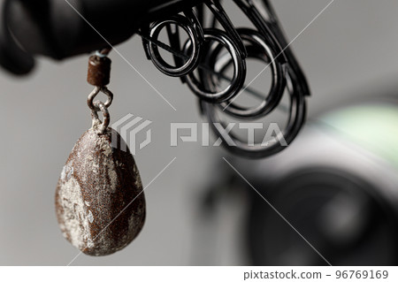 Spinning for fishing on grey background close up 96769169