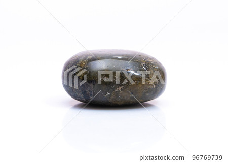 Natural gemstone labradorite isolated on white background. Dark gray labradorite with an inner iridescent glow on a white background 96769739