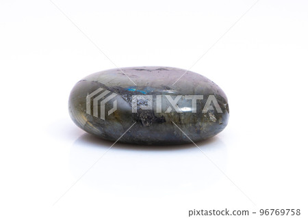 Natural gemstone labradorite isolated on white background. Dark gray labradorite with an inner iridescent glow on a white background 96769758