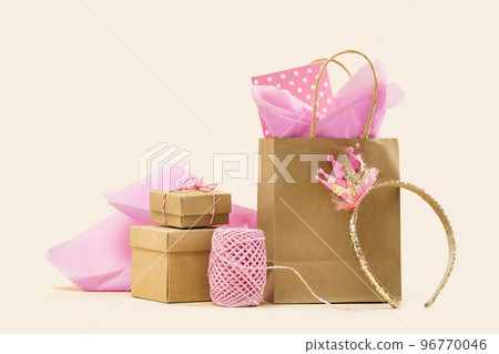 Golden crown headband for little princess. Gift or Sale concept. Shopping buff paper bag with pink tissue. Polka dot gift card. Holiday birthday party gift wrapping. baby shower for girl 96770046