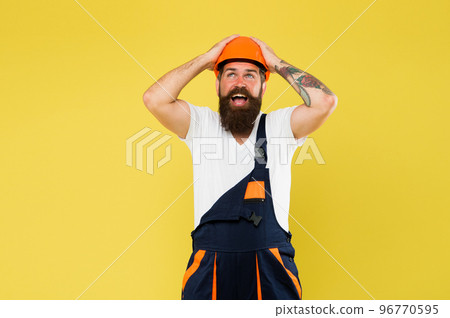 brutal male worker. keep head safe in helmet. building is my passion. on construction site. repairman fix anything. man in uniform. mature and experienced builder in hard hat. expert in renovation 96770595