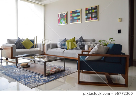 Interior design of cozy living room with stylish sofa, coffee table, dired flowers in vase Interior design of cozy living room with stylish sofa, coffee table, dired flowers in vase 96772360