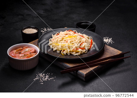 Delicious fresh rice noodles with shrimp, spices and herbs 96772544
