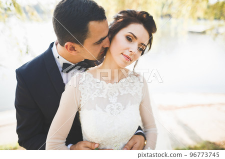 Close up of a nice young wedding couple Close up of a nice young wedding couple 96773745